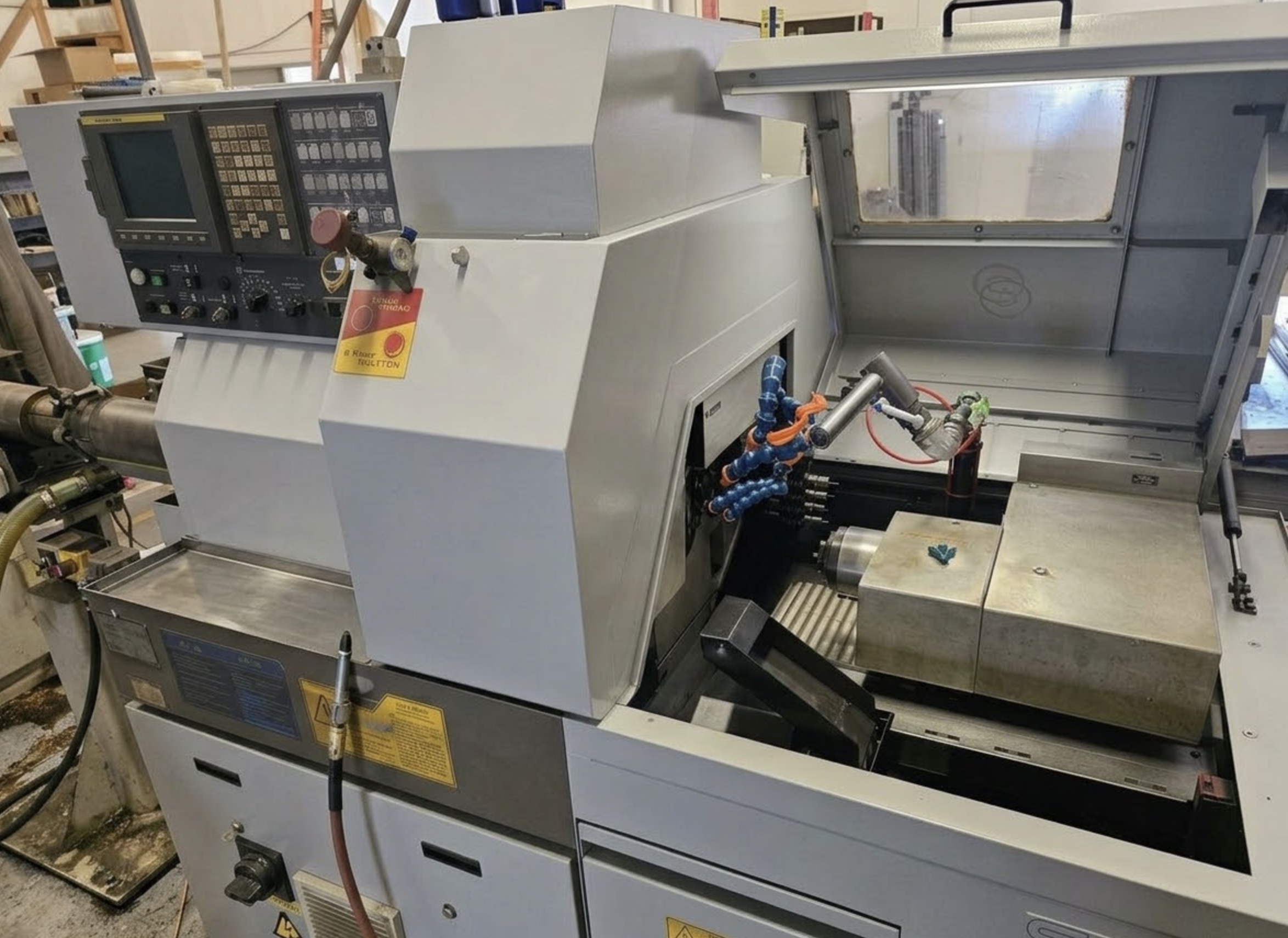 Star SB-16 Swiss-type turning machine with open work area and bar feed at left